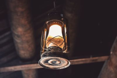 Lit lantern hanging from ceiling