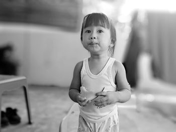Portrait of cute girl standing outdoors