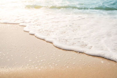 Close-up of wet sand on beach