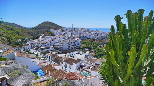 High angle shot of townscape against clear blue sky