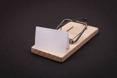High angle view of open book on table against black background