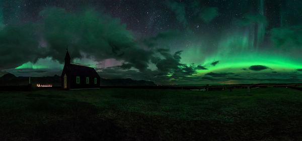 Storm clouds over field at night