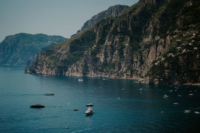 Scenic view of sea against mountain