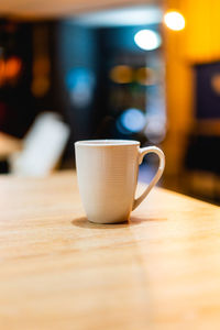 Close-up of coffee cup on table
