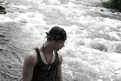 Portrait of man looking at sea shore