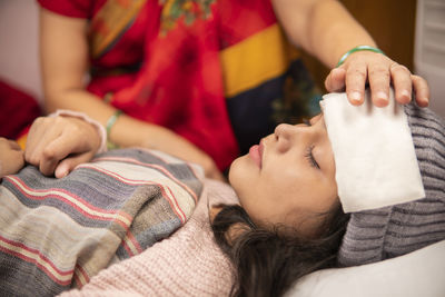 Midsection of doctor examining patient