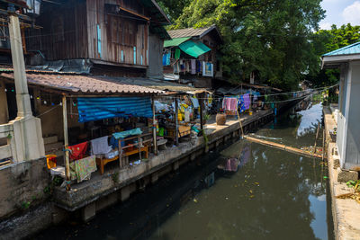 Bridge over canal amidst buildings