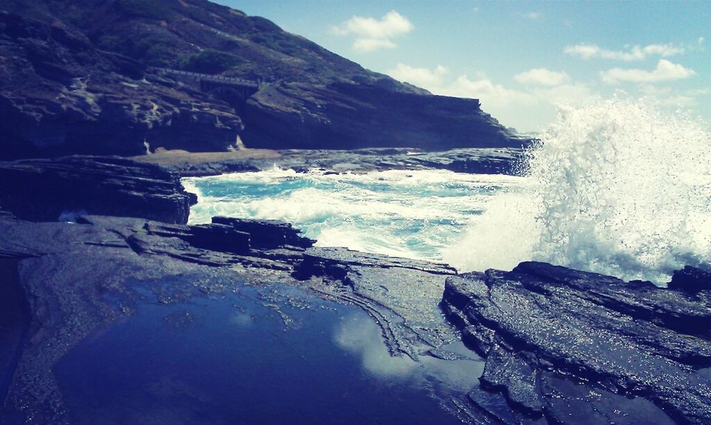 water, sea, beauty in nature, scenics, surf, sky, nature, wave, tranquil scene, rock - object, tranquility, rock formation, cold temperature, motion, mountain, idyllic, winter, horizon over water, shore, snow