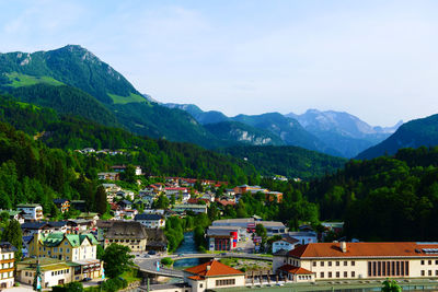 High angle view of houses in town against sky