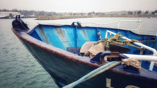 High angle view of boat moored on sea against sky