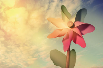 Low angle view of toy against sky during sunset