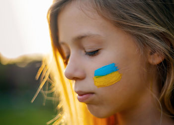 Close-up of young woman looking away