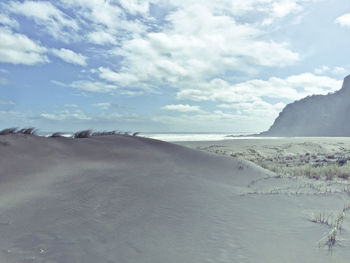 View of calm beach against the sky