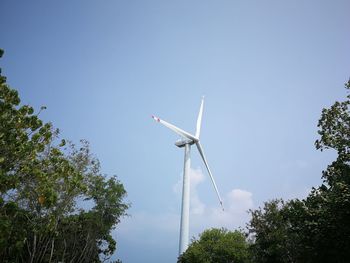 Low angle view of wind turbine against sky