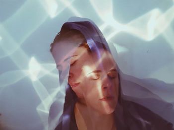 Portrait of young woman in swimming pool