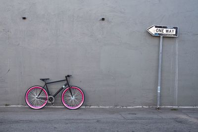 Bicycle leaning against wall