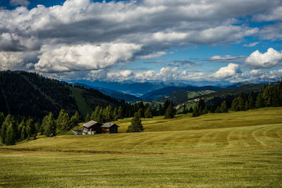 Scenic view of landscape and mountains against sky