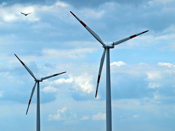 Low angle view of windmill against sky