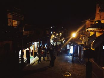 View of illuminated street lights at night