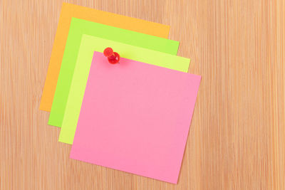 High angle view of multi colored paper on table