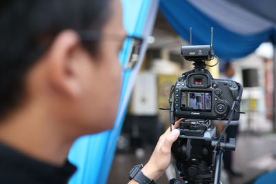 Close-up of man photographing