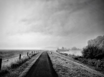 Narrow footpath along calm sea