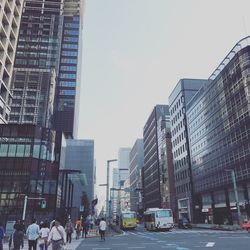 Modern buildings in city against clear sky