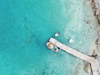 High angle view of woman relaxing on sea shore