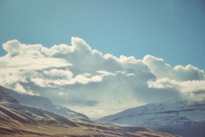 Scenic view of snowcapped mountains against sky