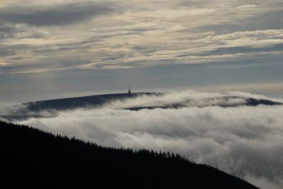 Scenic view of silhouette mountain against dramatic sky