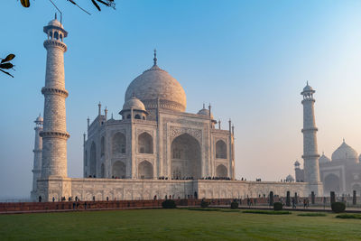 Early morning view of the taj mahal, agra, india against blue sky
