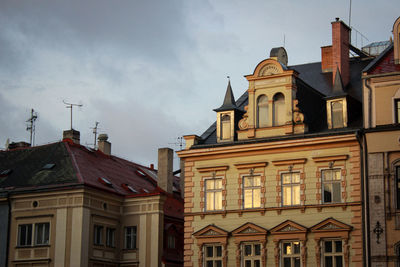 Low angle view of buildings in city against sky