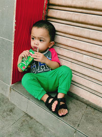 Portrait of boy holding food