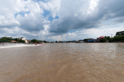 View of beach against cloudy sky