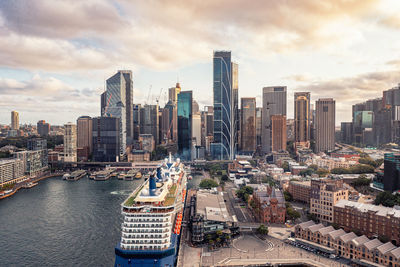 Aerial view of modern skyscrapers and buildings near port on cloudy day. travels sydney, australia.