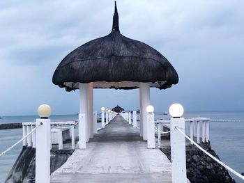 View of pier over sea against sky