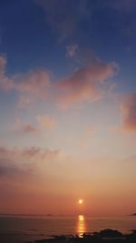 Scenic view of sea against sky at sunset