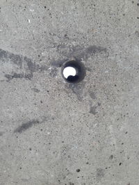 High angle view of hole on wall