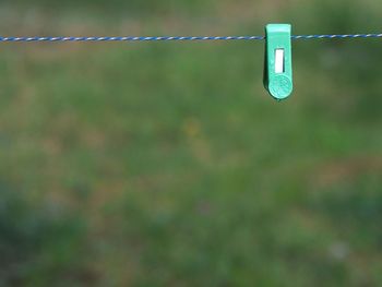 Close-up of clothespins on clothesline