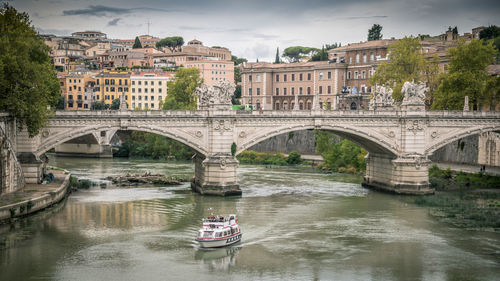 View of the statue of traiano with ancient churches and city of rome in background. roma italy 