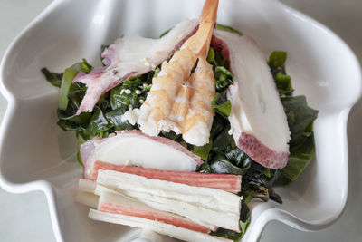 High angle view of fish in plate on table