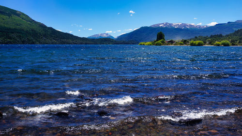 Scenic view of sea against mountains