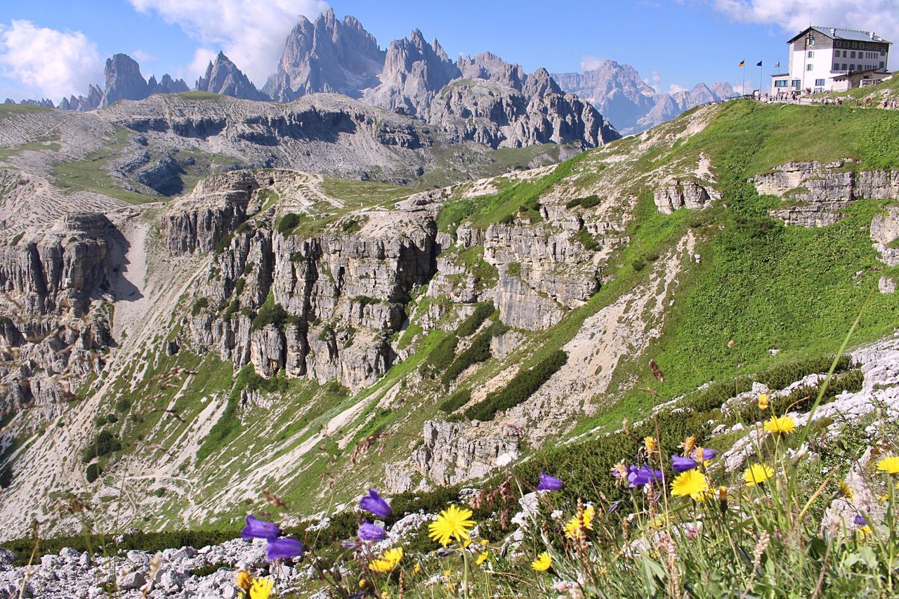 mountain, nature, beauty in nature, mountain range, day, tranquil scene, outdoors, rock - object, tranquility, scenics, no people, sky, landscape, flower