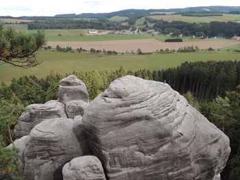 Statue on landscape against sky