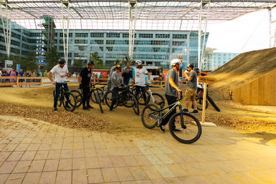 People riding bicycles on road