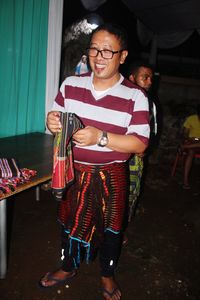 Portrait of smiling young woman standing outdoors