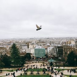 Group of people in front of cityscape