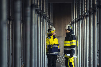 Engineers talking at building site