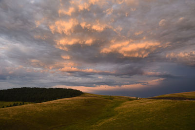 Scenic view of landscape against sky during sunset