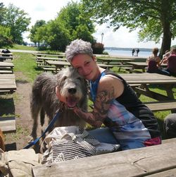 Portrait of smiling woman with dog